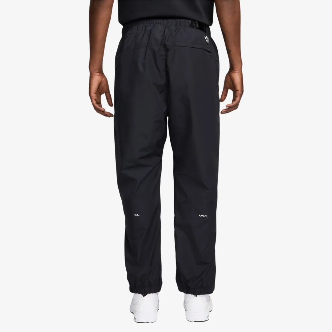 mens nike nocta nylon track pants (black)